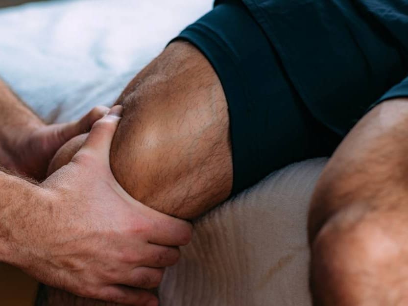 Physiotherapist treating a weight training injury in Glasgow